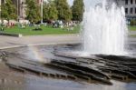 People Relaxing Next To The Fountain At The Cathedral In Berlin Stock Photo