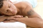 Handsome Male Lying In Spa Resort Stock Photo