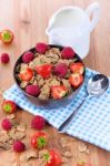 Bran Flakes With Fresh Raspberries And Strawberries And Pitcher Stock Photo