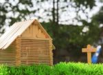 Wood Home For Sale On Green Grass Field Stock Photo