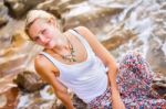 Beautiful Young Blonde Woman Posing Outdoor At The Rocky Sea Sho Stock Photo