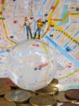 Miniature Traveller Or Backpacker Stand On Globe Of Glass, Euro Stock Photo