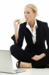 Woman Eating With Laptop Stock Photo