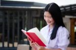 Asia Thai High School Student Uniform Beautiful Girl Read A Book Stock Photo