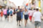 Blurred People Walking On The Street Of Old Town Stock Photo