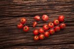 Organic Fresh Cherry Tomatoes On Wooden Background Stock Photo