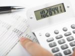 Bookkeeping With Calculator Stock Photo