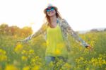 Beautiful Young Woman Enjoying Summer In A Field Stock Photo