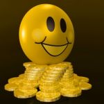 Smiley Face With Coins Shows Profitable Earnings Stock Photo