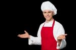 Young Male Chef Welcoming His Guests Stock Photo