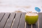 Coconut Water Drink Served In Coconut With Drinking Straw On The Stock Photo