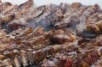 Traditional Meat Grilled On The Grill In The Argentine Countryside Stock Photo