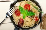 Spaghetti Pasta With Baked Cherry Tomatoes And Basil Stock Photo