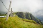 A Woman Shoot The Steel Catwalk Over Alps Round The First Top St Stock Photo