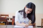 Portrait Of Thai Teen Beautiful Girl Writing Book Stock Photo