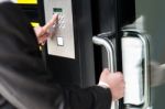 Man Entering Security Code To Unlock The Door Stock Photo