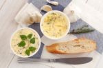 Baguette With Herb Butter And Rosemary Thyme On Rustic Wooden Background Stock Photo