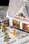 Gingerbread House And Snowman Stock Photo