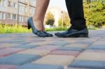 Feet Of Man And Woman While Kissing On A Romantic Meeting Stock Photo