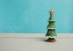 Christmas Tree On Wooden Background With Snow Stock Photo