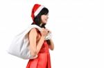 Santa Woman  Holding A White Bag Stock Photo