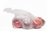 View Of Some Peaches Inside A Plastic Bag Stock Photo