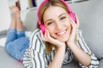 Beautiful Young Woman Listening To Music At Home Stock Photo