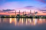 Oil Refinery At Twilight In Bangkok, Thailand Stock Photo