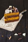 Slice Of Chocolate And Toffee Layer Cake Stock Photo