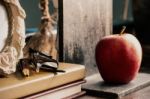 Stationery And Apple On Desk Stock Photo