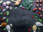 Top View Of Food Ingredients And Condiment On The Table, Ingredients And Seasoning On Dark Wooden Floor Stock Photo