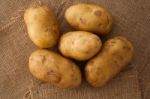 Potato Still Life On Sack Background Flat Lay Stock Photo