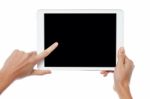 Finger Being Pointed On Tablet Screen Stock Photo