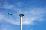 Wind Energy Turbine On Blue Sky Background Stock Photo