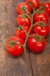 Fresh Cherry Tomatoes On A Cluster Stock Photo