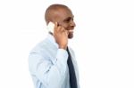 African Male Is Using Cell Phone Stock Photo