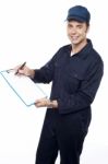 Young Male Holding Clipboard Stock Photo