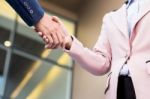 Closeup Friendly Meeting Handshake Between Business Woman And  B Stock Photo