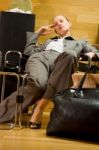 Business Woman Sleeping In Lobby Stock Photo