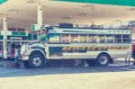 Colorful Bus At Gas Station In Small Town Of Chinique, Guatemala Stock Photo