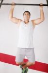 Strong Man Doing Pull Ups On Bar Stock Photo