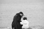 Back View Of Mother And Daughter Stock Photo