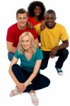 Friends Sitting On Floor Stock Photo