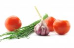 Mediterranean Food Ingredients: Spring Onions, Garlic And Tomato Stock Photo