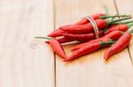 Closeup Red Chili Peppers Spice Ingredient On Wood Table Stock Photo