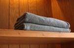 Towel On Wooden Shelf Stock Photo