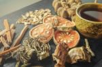 Dried Herbs And Ginseng, Top View Of Thai Herbs And Ginseng On Wooden Floor Stock Photo