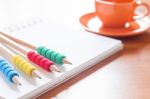 Pencils On Open Blank White Notebook With Coffee Cup On The Desk Stock Photo