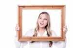 Woman With A  Wooden Photo Frame Stock Photo