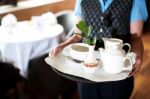 Woman Holding Tea Tray Stock Photo